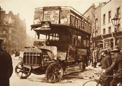 Wreckage of a bus that had been set on fire by strikers in South London, 1926 by English Photographer